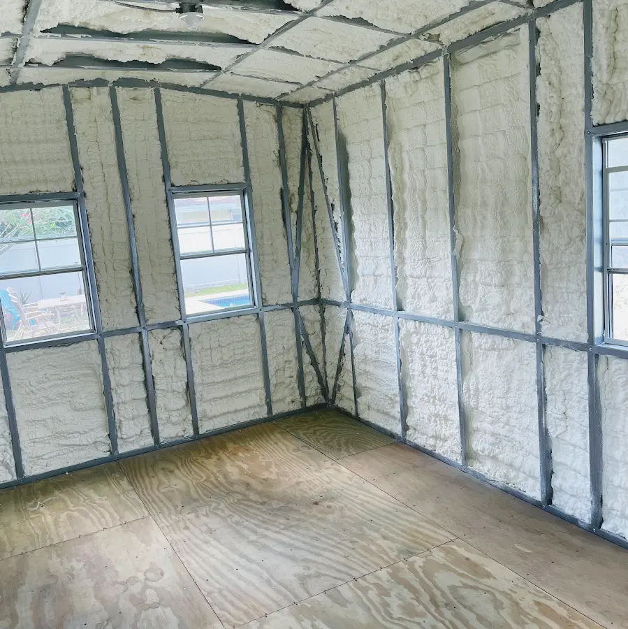 Closed-cell spray foam insulation applied to wall cavities in a residential project in Ponca City